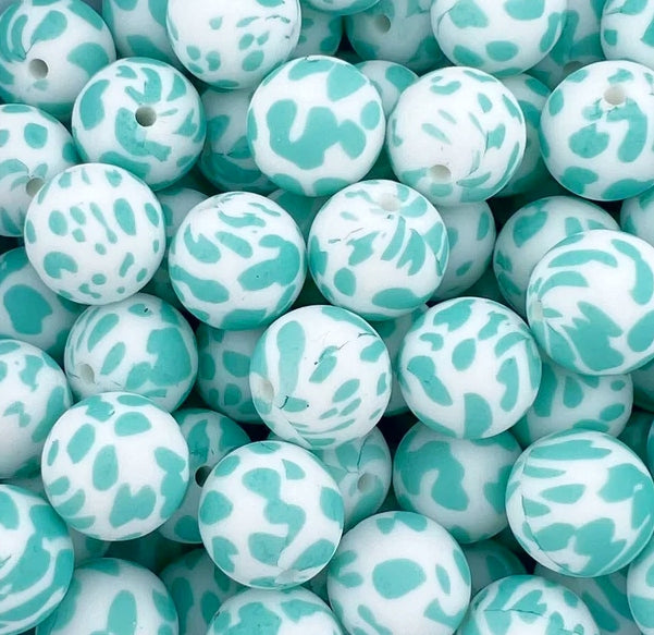 P171 TURQUOISE COW 15MM PRINT (10ct)