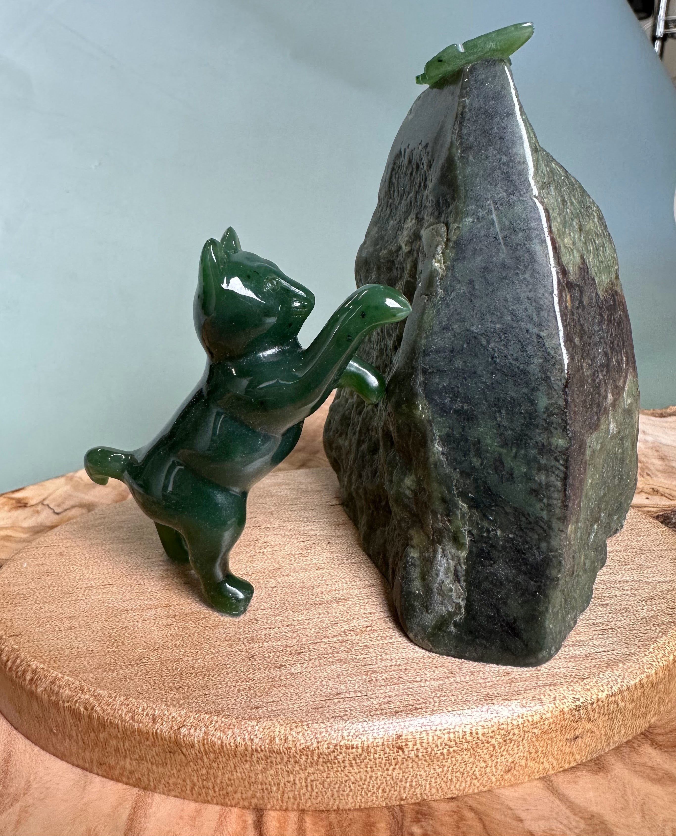 Cat Pawing at Jade Butterfly
